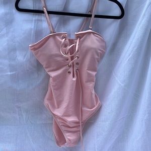 never worn tie up pink one piece